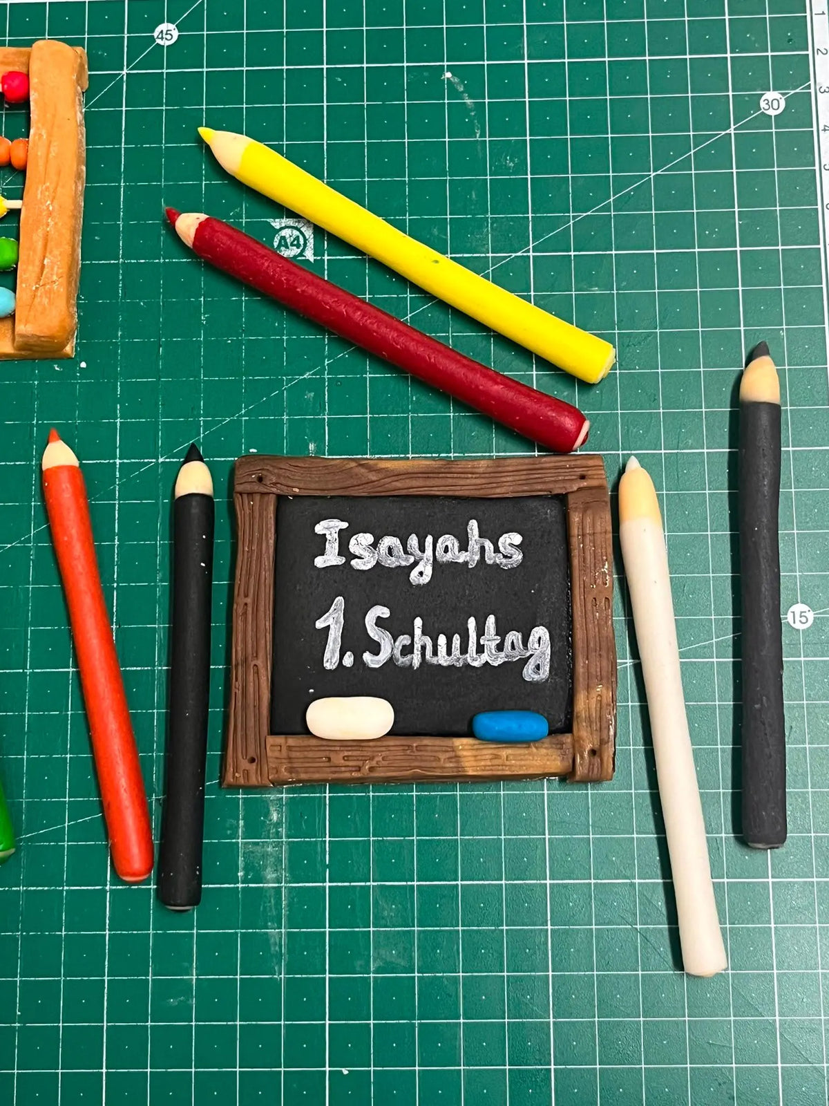 Handmade edible school-themed fondant cake decoration, image 3.