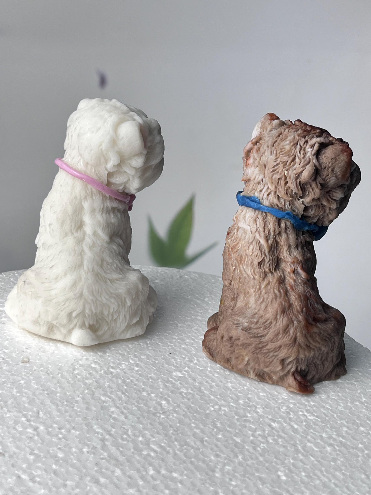 Rear view of white and brown edible fondant terrier dog cake toppers.
