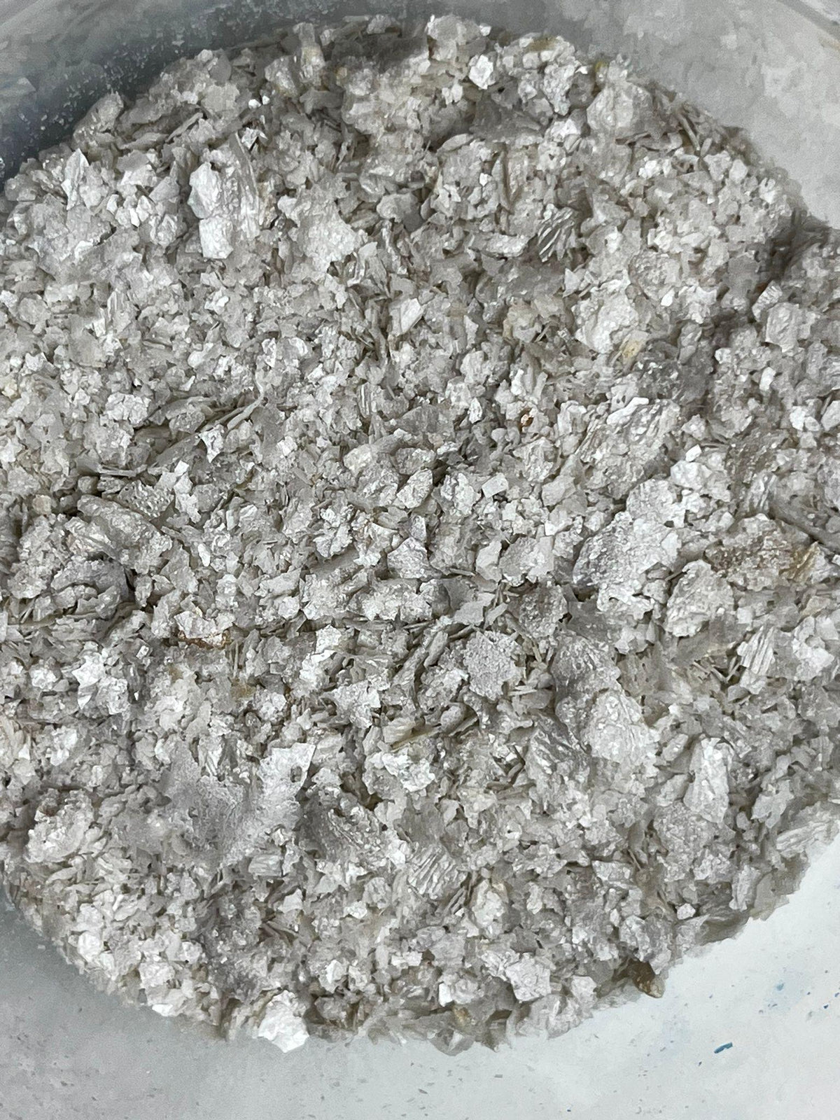 Pearl edible wafer paper glitter flakes shown close up for cake and dessert decoration.