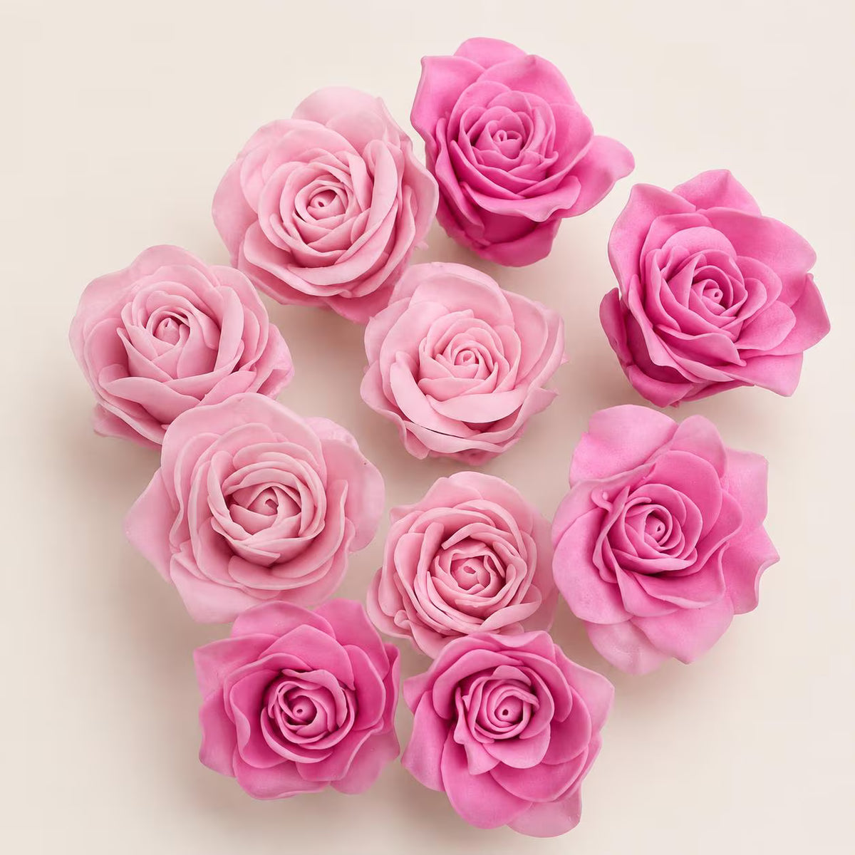 Pink handmade edible sugar roses in different shades.
