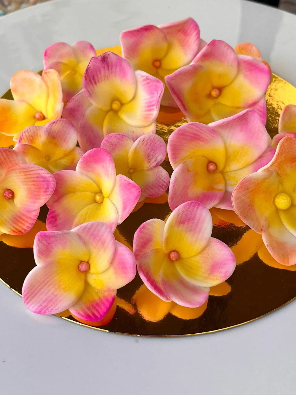 Handmade edible plumeria sugar flowers for tropical cake decoration, image 6.