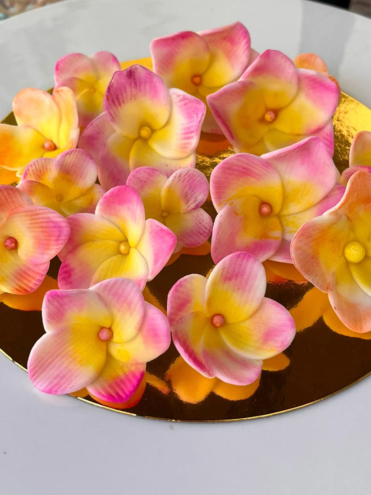 Handmade edible plumeria sugar flowers for tropical cake decoration, image 6.