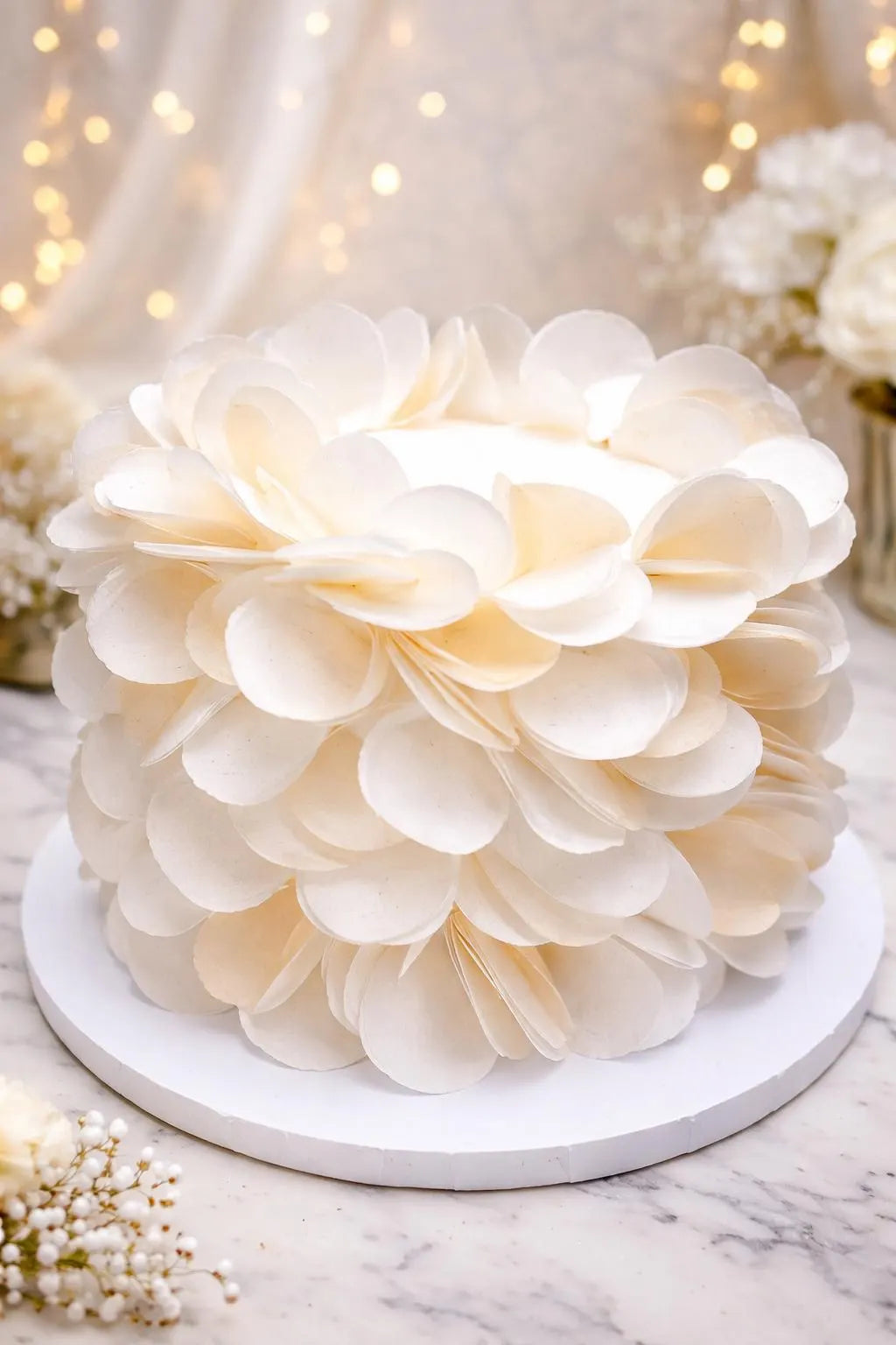 Round white edible wafer paper discs for cake decorating projects.