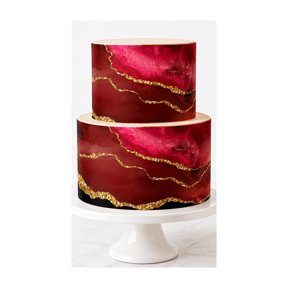 Two-tier ruby red and burgundy marble cake with gold-effect veins displayed on a white pedestal