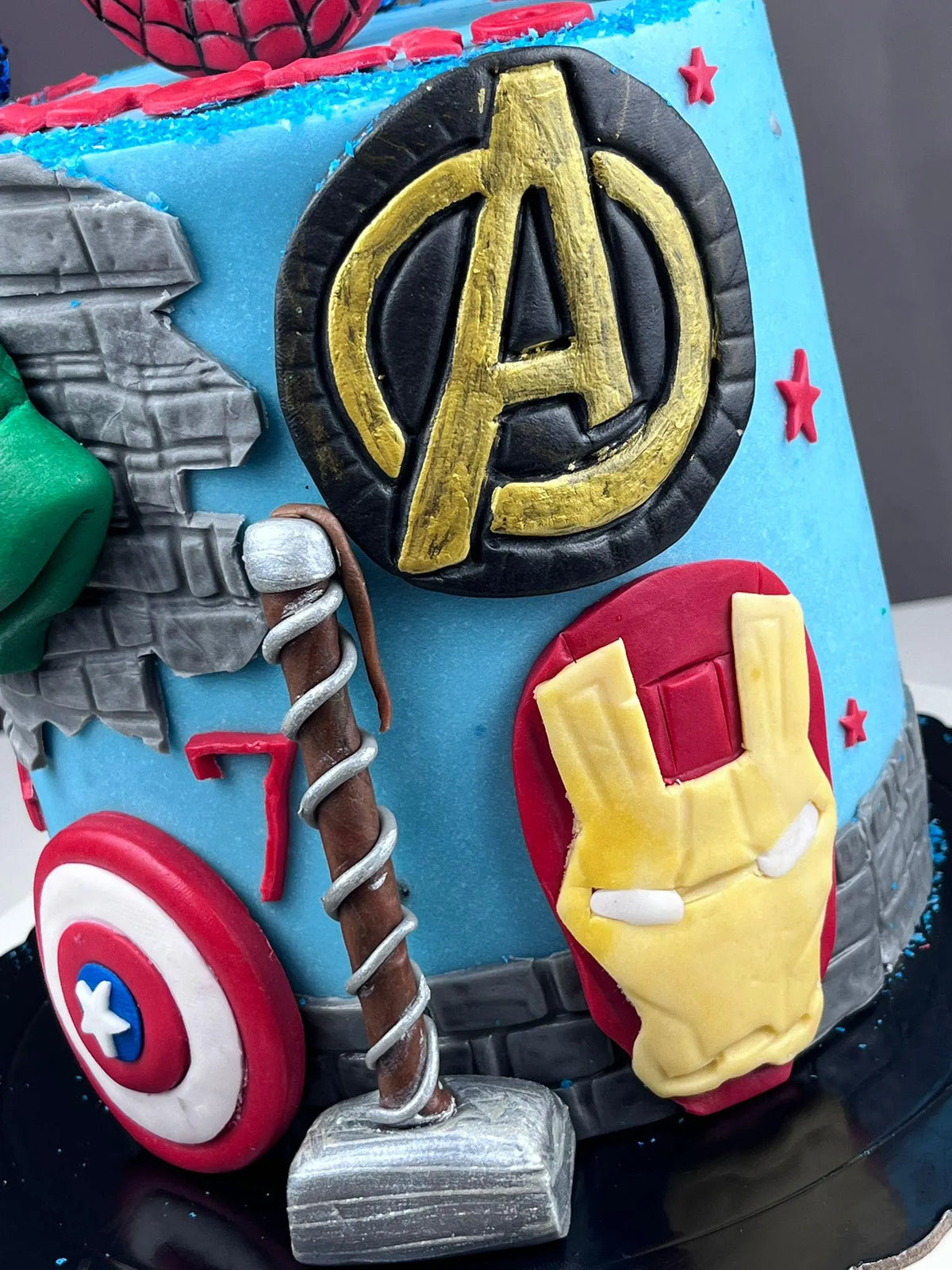 Handmade edible superhero fondant cake decoration, image 2.