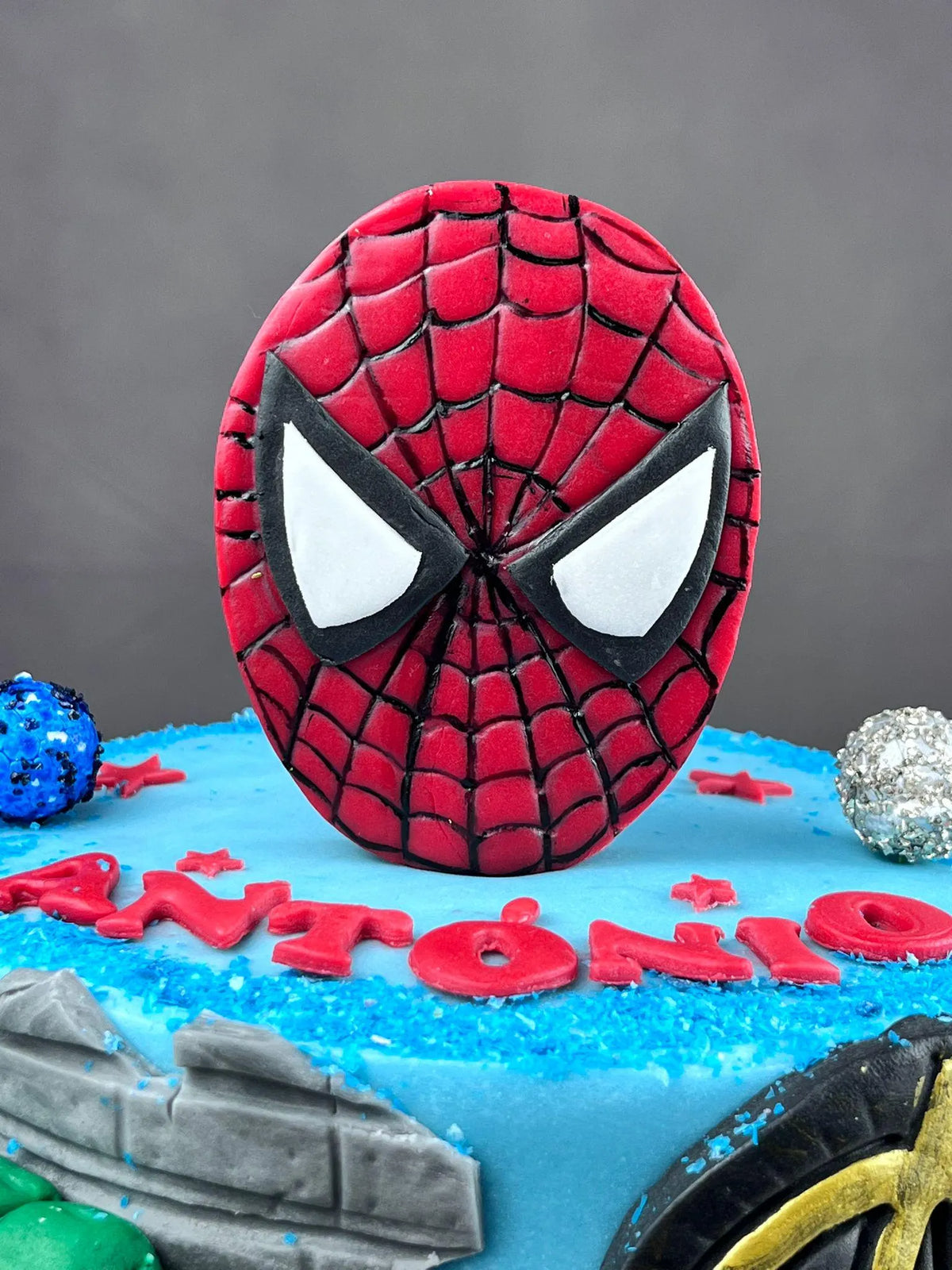 Handmade edible superhero fondant cake decoration, image 5.