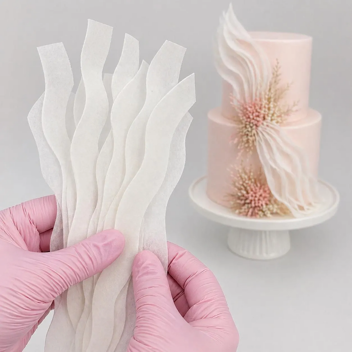 Edible wafer paper strips ready for creating textured cake decorations.