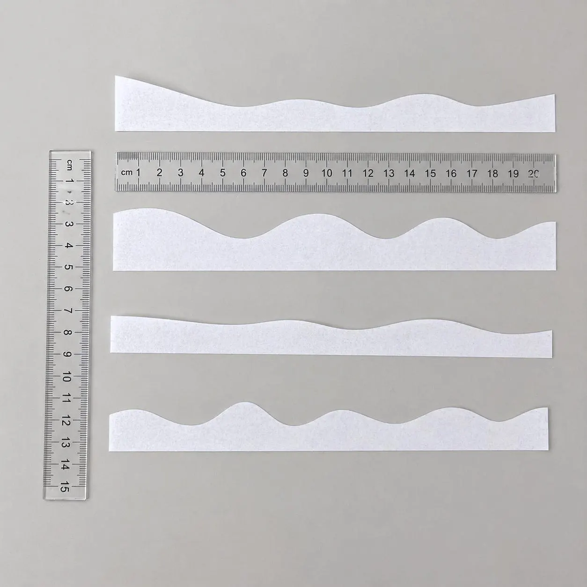 Precut edible wafer paper ruffles for decorating wedding and celebration cakes.