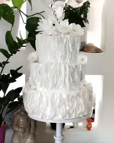 Wafer paper cake decorating strips for creating delicate edible layered effects.